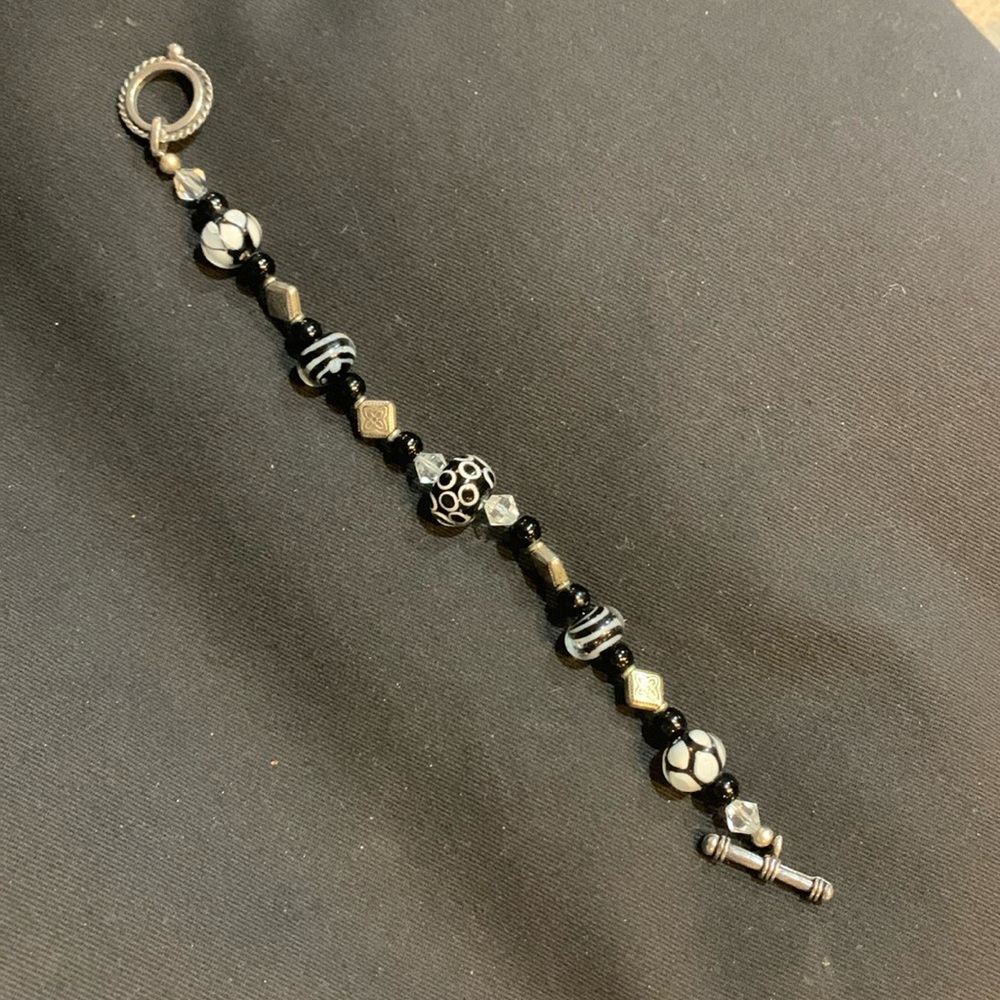 Costume jewelry. 8 inch long bracelet. Silver black and white.